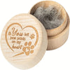 A natural wooden pet hair keepsake box with a heart design and a lid showing collected pet hair.