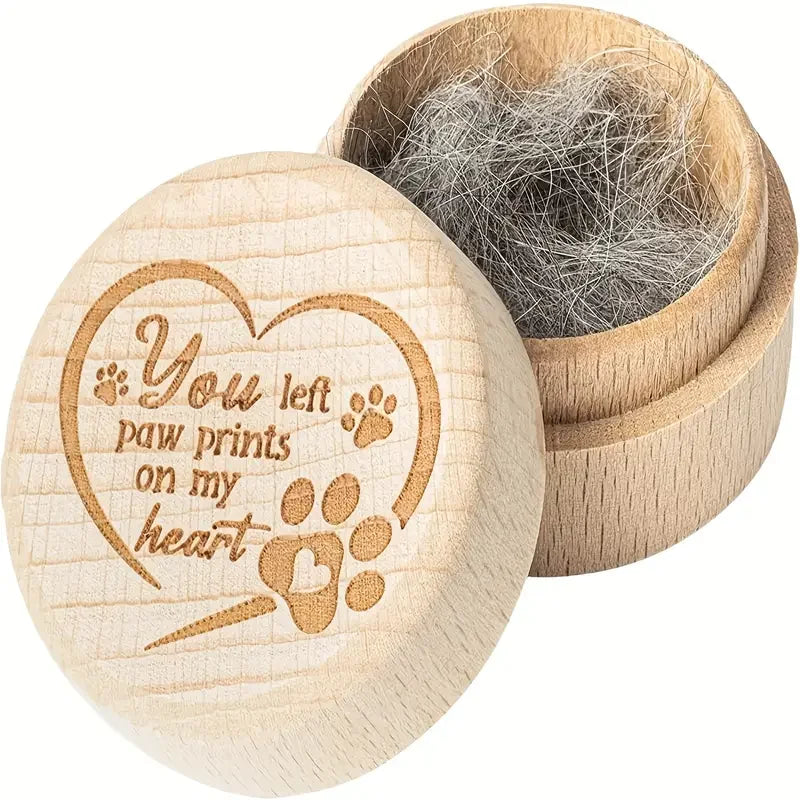 A natural wooden pet hair keepsake box with a heart design and a lid showing collected pet hair.