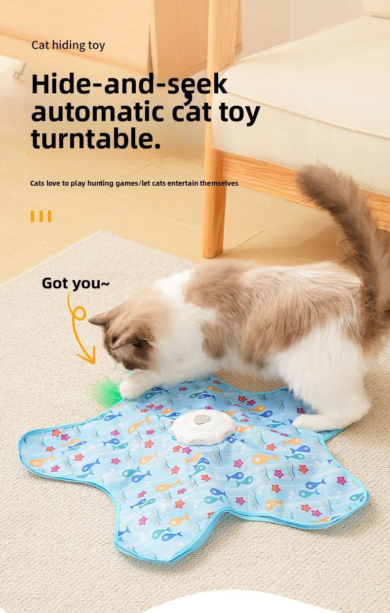 A fluffy tabby cat is playing with a blue, patterned toy on the floor.