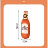 An orange plush beer bottle dog toy with a yellow cap and a squeaker.