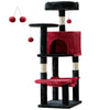 A multi-level sisal cat climbing tree with black posts, red fabric platforms, and dangling pom-poms.