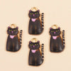 A set of four dark cat pendant charms with glitter and purple accents for jewelry making