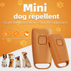 A pair of orange ultrasonic dog repellent devices shown next to several dogs.