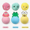 Three fluffy toys: a pink bird, a blue frog, and a yellow cricket.