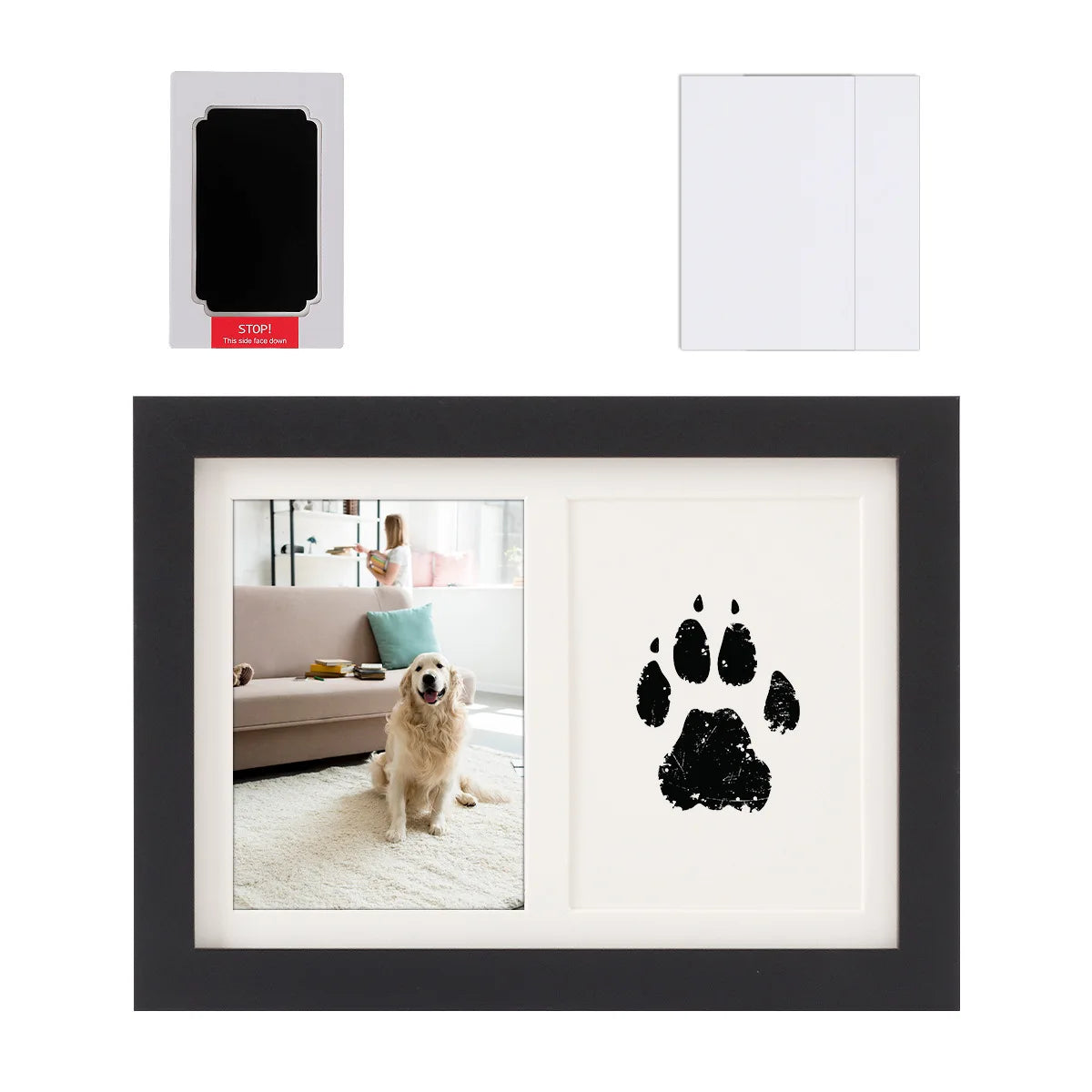 A black framed picture featuring a black dog paw print on a white background.