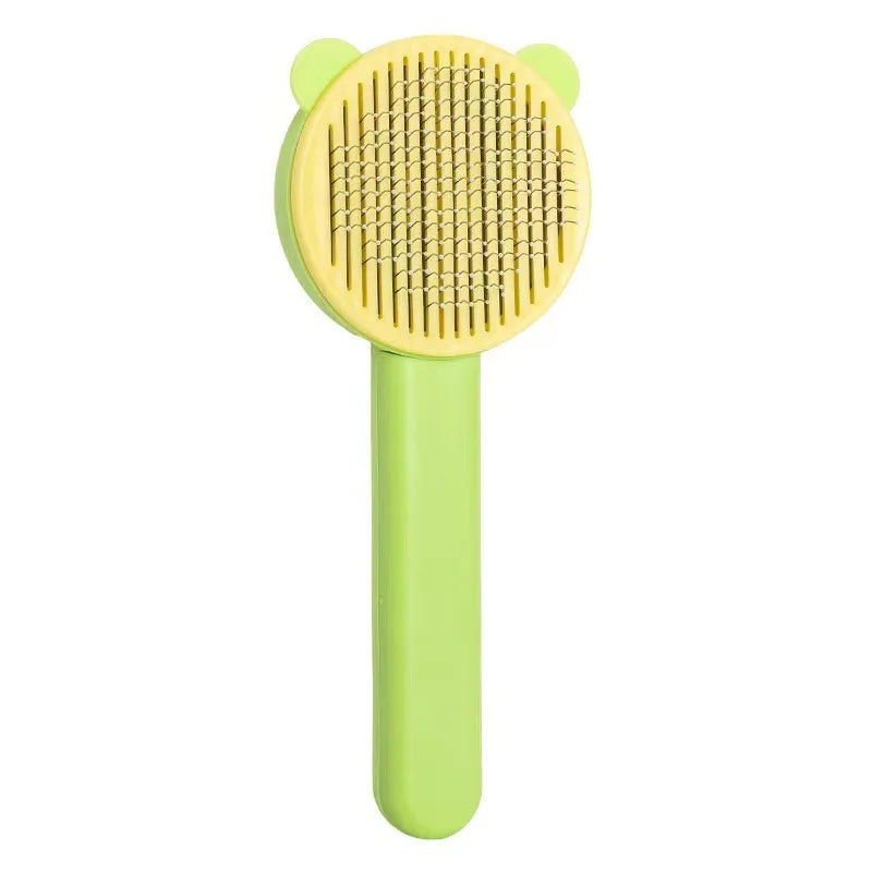 A light green pet hair removal brush with a textured silicone head and a smooth handle.