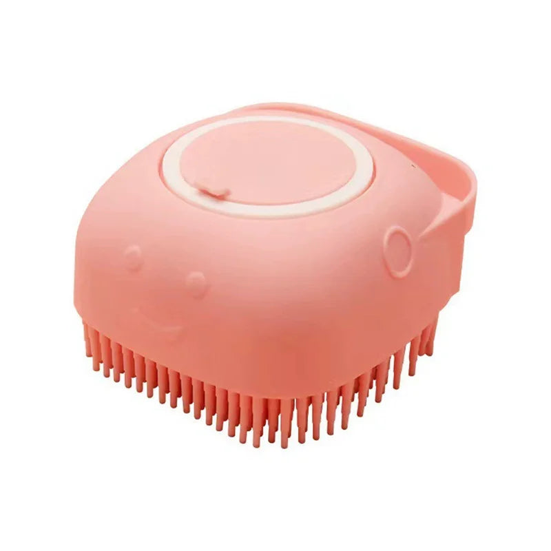 A pink silicone pet bath massage brush with foam maker head.