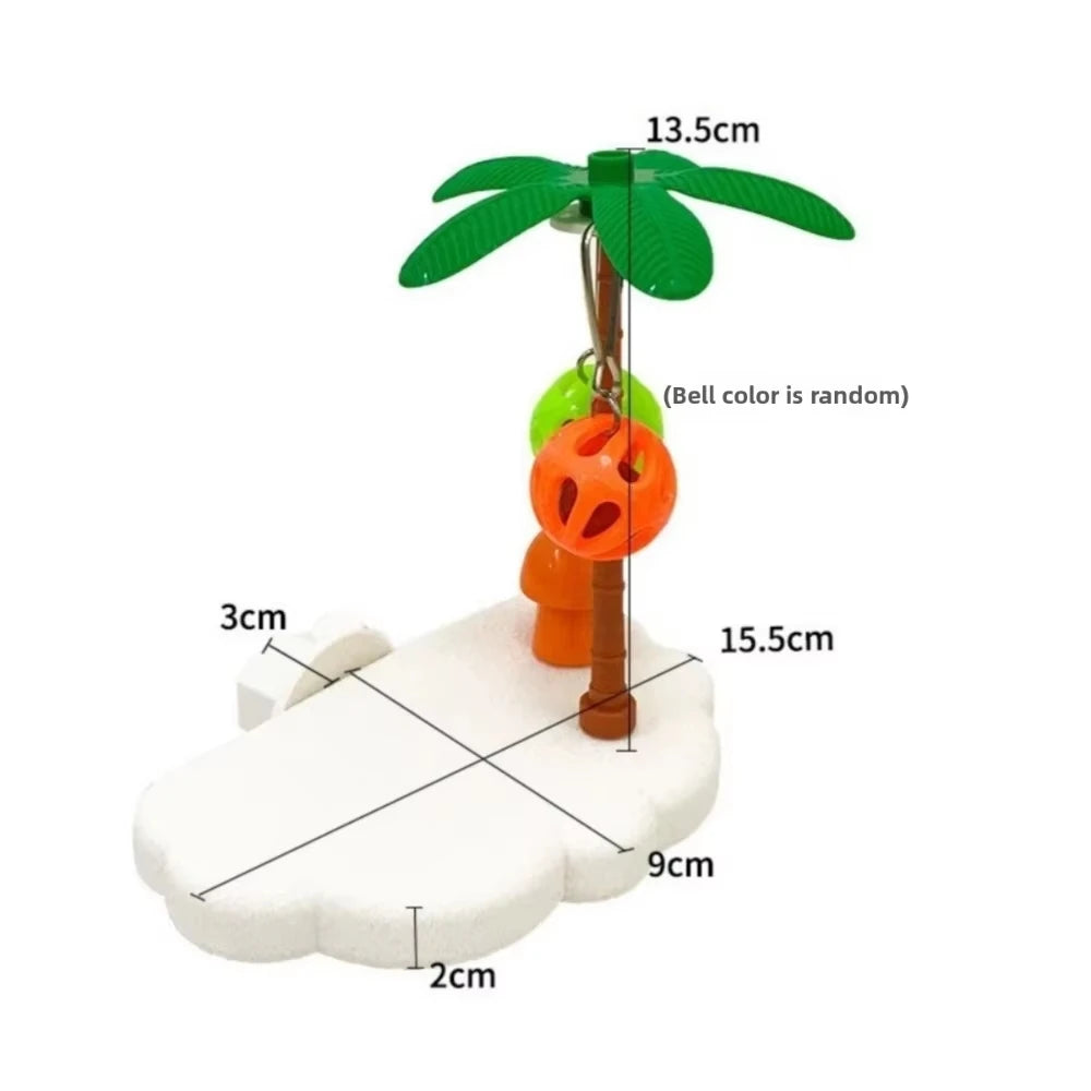 A tropical bird play perch featuring a green palm leaf and an orange ball toy on a white base.