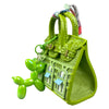 Handcrafted mini house-shaped bag in lime green with a puppy keychain charm