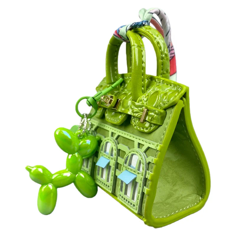 Handcrafted mini house-shaped bag in lime green with a puppy keychain charm
