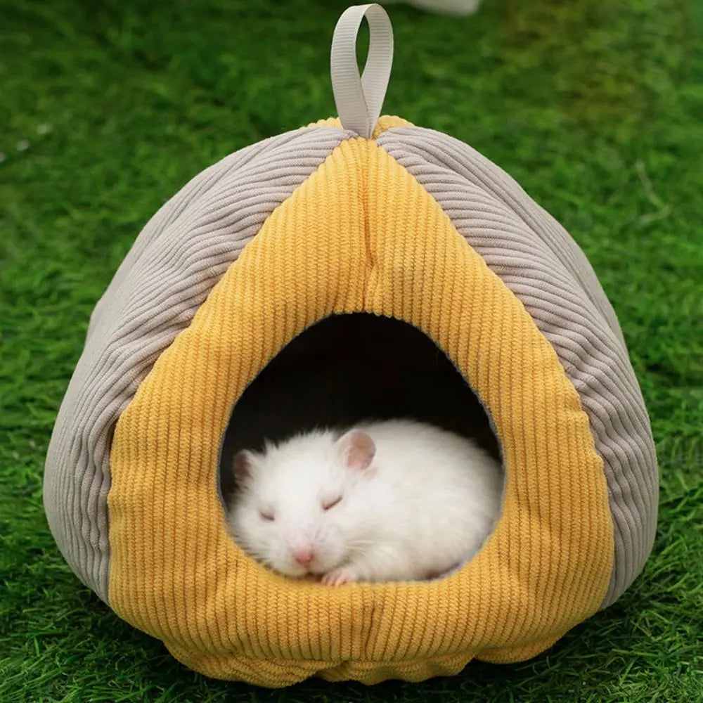 A cozy plush hanging nest in yellow and gray for a small pet, resembling a hollowed-out seed pod.