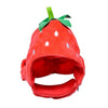 A bright red strawberry shaped pet hat for cats and dogs with green leaves.