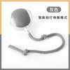 A gray smart pet ball with a cord, designed for a touch-activated mode.