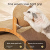 A dog gently grips a woven sisal tight grip cat scratcher ball made of wood.