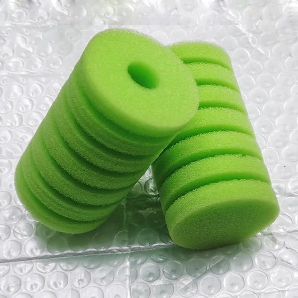 A stack of bright green biological aquarium sponge filter media.