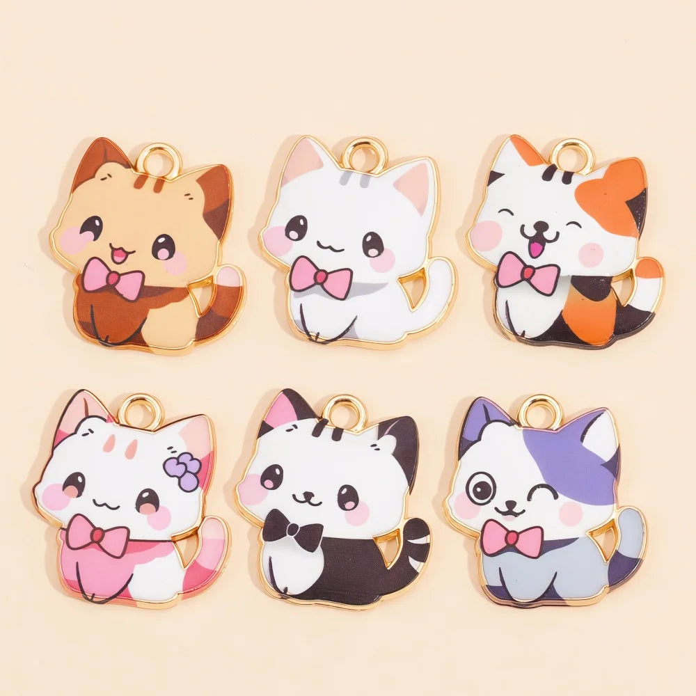 A set of four colorful cat and animal pendant charms for jewelry making featuring various orange, white, and gray cats with b