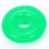 A bright green spiky squeaky dog chew toy for dental care