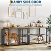 A black wire crate for dogs with a glass door and a wooden top, placed on a rug.