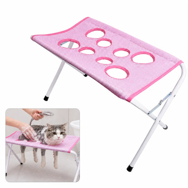Pink foldable pet grooming hammock stand with multiple mesh pockets for grooming pets