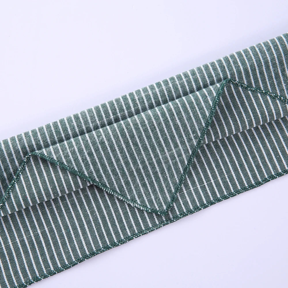 A close-up of a blue and white striped cotton dog bandana fabric.