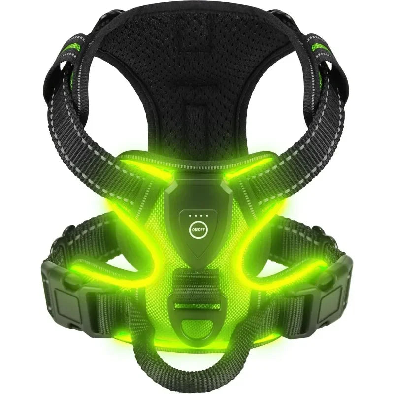 A black dog harness with bright neon green LED lights illuminating the chest area.