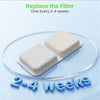 A beige replacement filter sponge is shown on a clear circular dish, with the text "2-4 weeks" displayed below.
