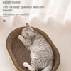 A tabby cat is resting in a large, round, woven scratching post designed for cat claws.