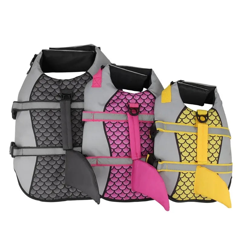 A set of dog swimming life jackets in gray, pink, and yellow for medium to large breeds