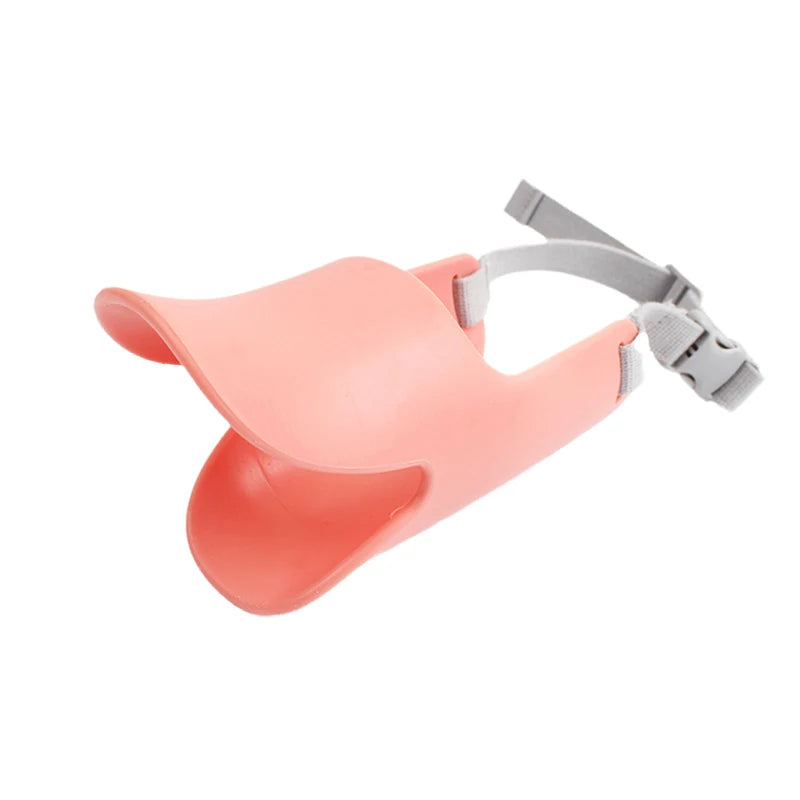 A pink Quack-Free training muzzle for small dogs with a gray strap.