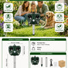 A black solar ultrasonic animal repeller with a motion sensor is shown in an outdoor garden setting.