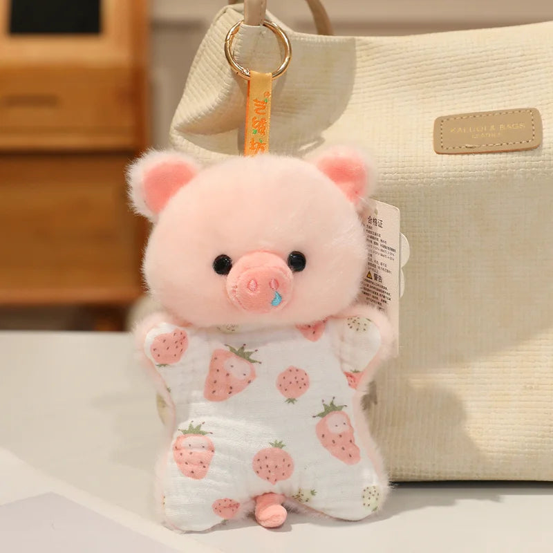 A pink cartoon pig bean bag plush toy with pink ears and a blue nose is displayed next to a cream-colored bag.