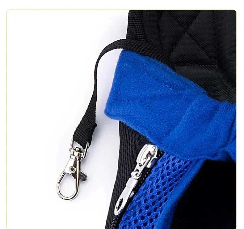 A close-up of a black and blue breathable mesh pet carrier backpack with a silver clasp.