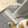 A white extendable pet hair lint roller is shown cleaning dust and hair from a cat's fur.