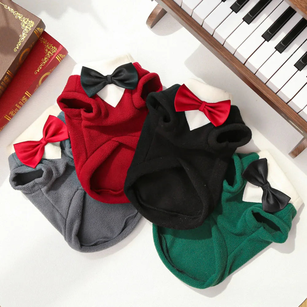 A collection of warm fleece dog tuxedo costumes with bow ties in red, black, gray, and green.