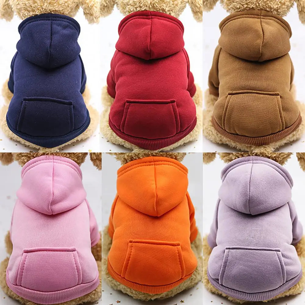 A collection of cozy pet hooded sweatshirts for dogs in various colors including navy, red, brown, pink, orange, and lavender