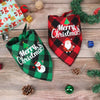 A plaid Christmas triangle bandana for dogs featuring a red and green pattern and a festive design.