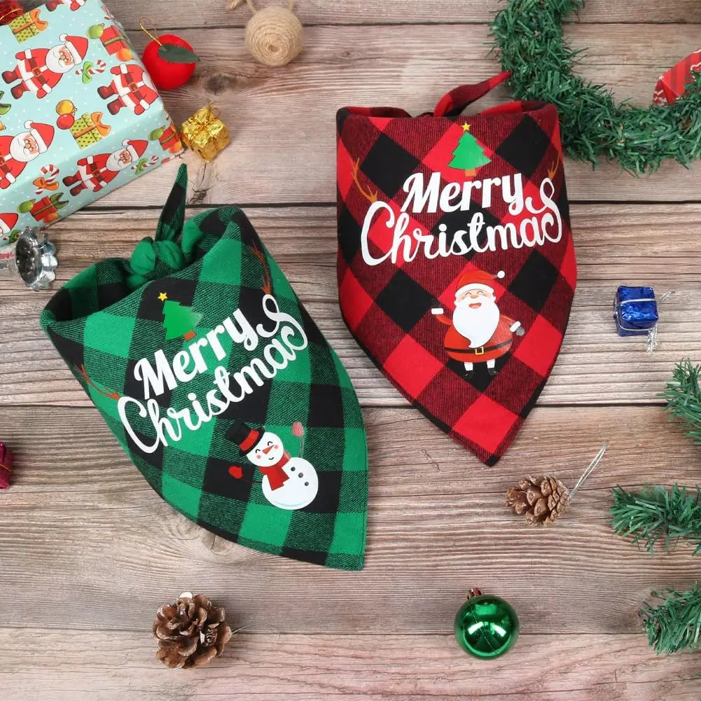 A plaid Christmas triangle bandana for dogs featuring a red and green pattern and a festive design.