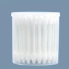 A clear plastic container filled with numerous white cotton swabs for gentle pet ear cleaning.