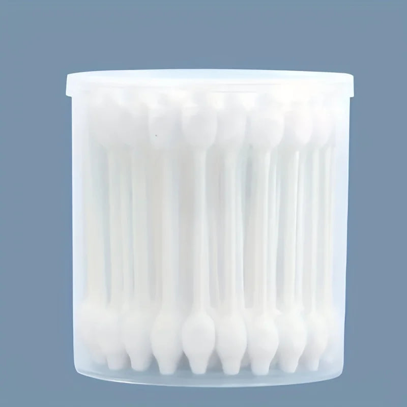 A clear plastic container filled with numerous white cotton swabs for gentle pet ear cleaning.