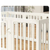 White heavy duty pet fence cage with vertical slats shown on a wooden floor.