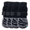 A set of black anti-slip dog socks with traction straps and gray grips.