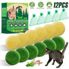 A set of 12 natural cat repellent balls in various shades of green and yellow, shown next to a tabby cat.