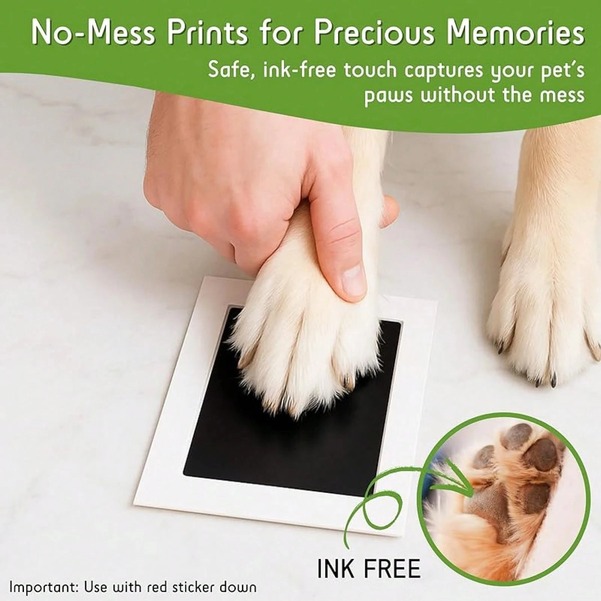 A hand gently places a paw print onto a white card, demonstrating an ink-free pet memory printing product.
