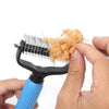 A hand is using a universal stainless steel pet detangling comb to remove tangled fur from a pet.