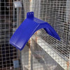 A bright blue plastic bird rest stand is shown against a wire mesh background.