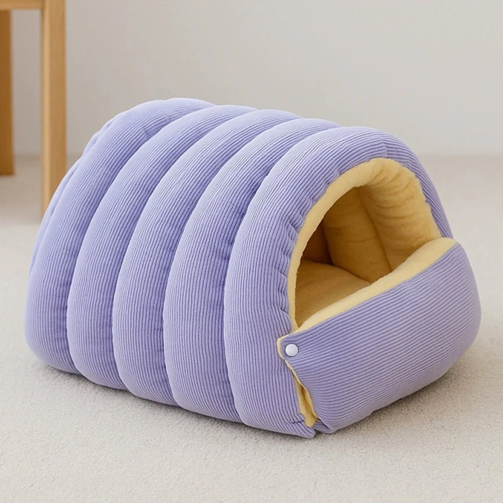 A light purple plush cat cave bed with ribbed fabric and a removable tan lining.