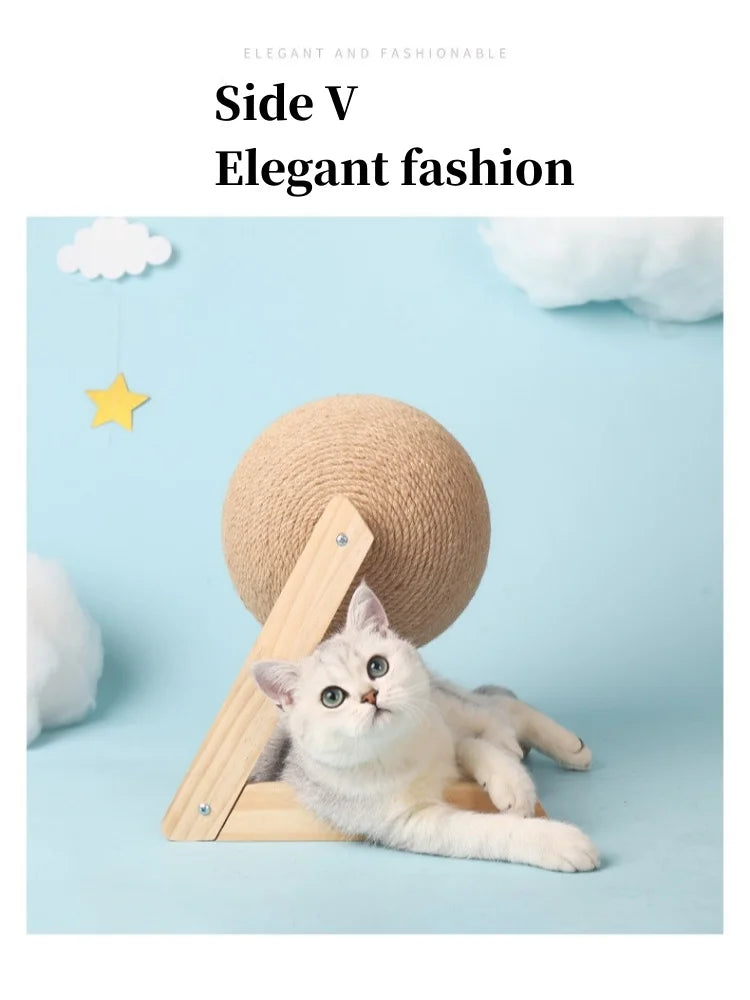 A white cat is relaxing on a wooden base next to a large, round beige sisal rope ball toy.