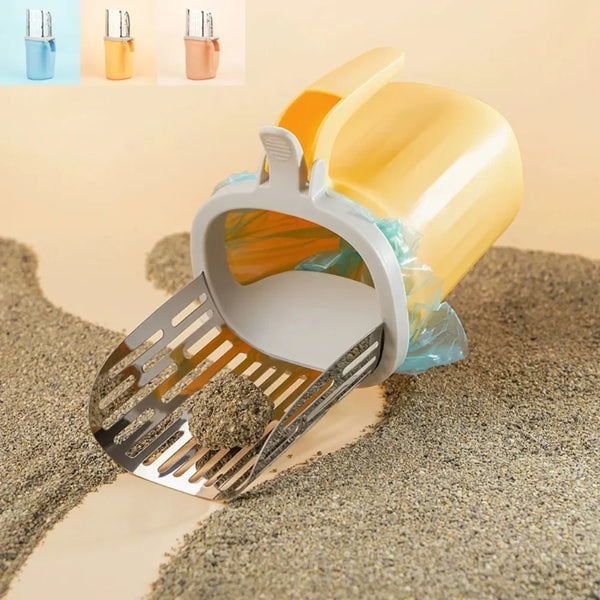 Stainless steel cat litter shovel with a yellow refill bag resting on a pile of litter.