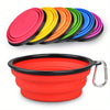 A set of colorful silicone dog travel bowls in various shades of pink, yellow, orange, green, and blue.
