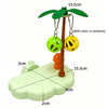 A tropical bird play perch with a wooden stand and hanging yellow and green toy balls.